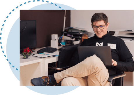 man sitting in a chair completing a domain search