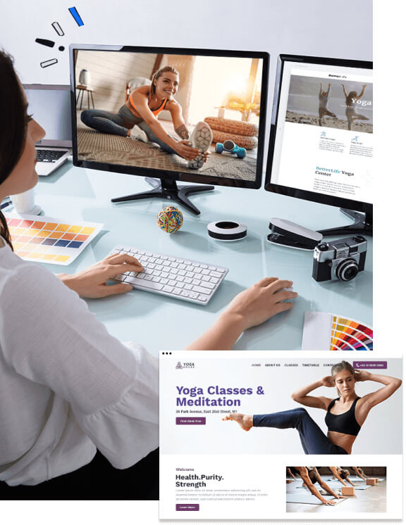 Female website designer working on computer displaying yoga website in progress of being built