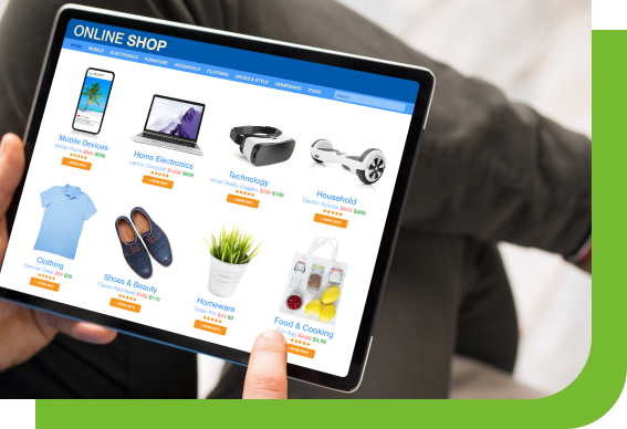Hands holding a tablet showing an ecommerce website