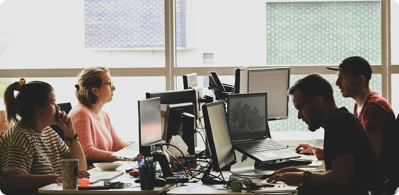 Image of People working on desktops