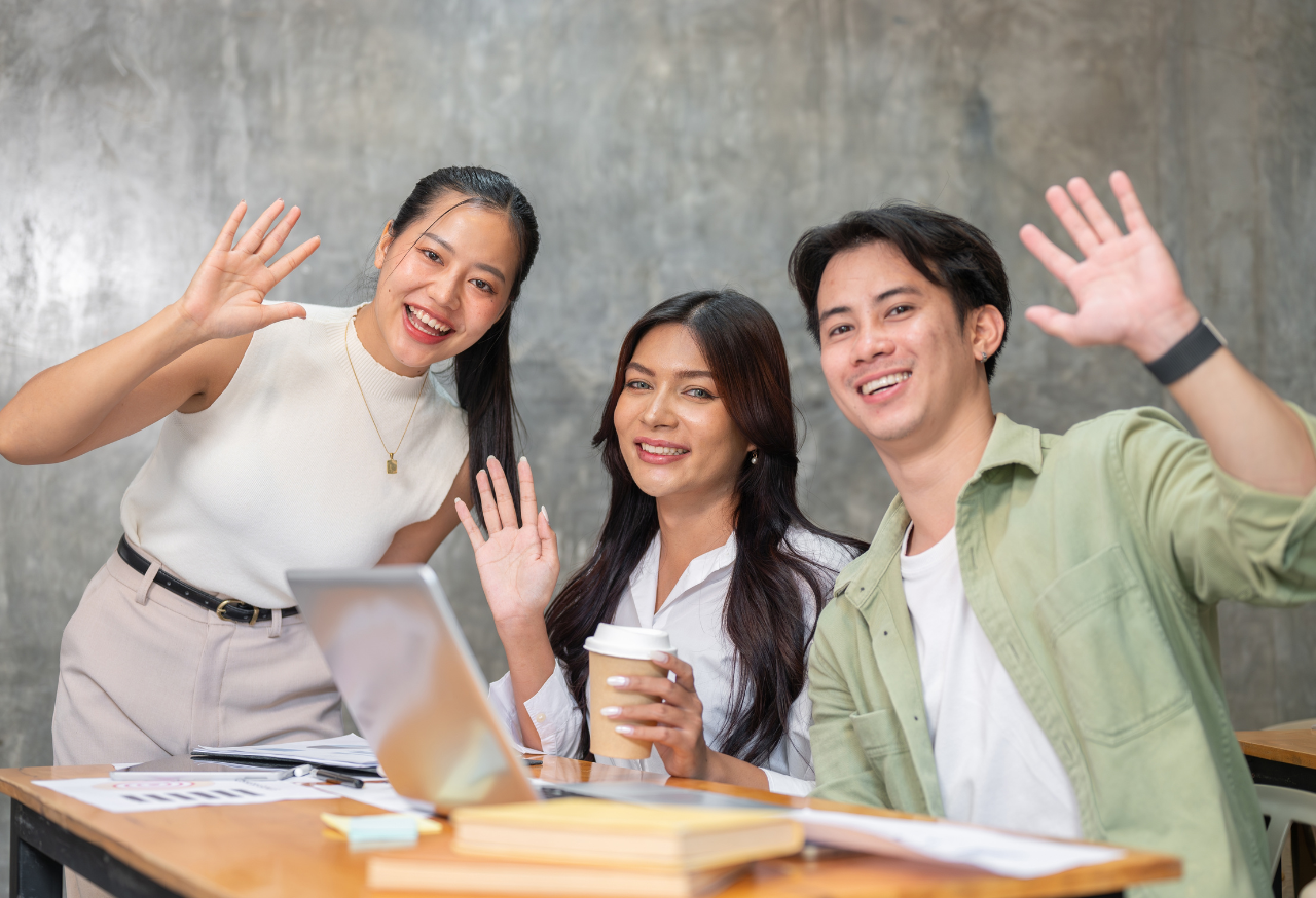 team members waving