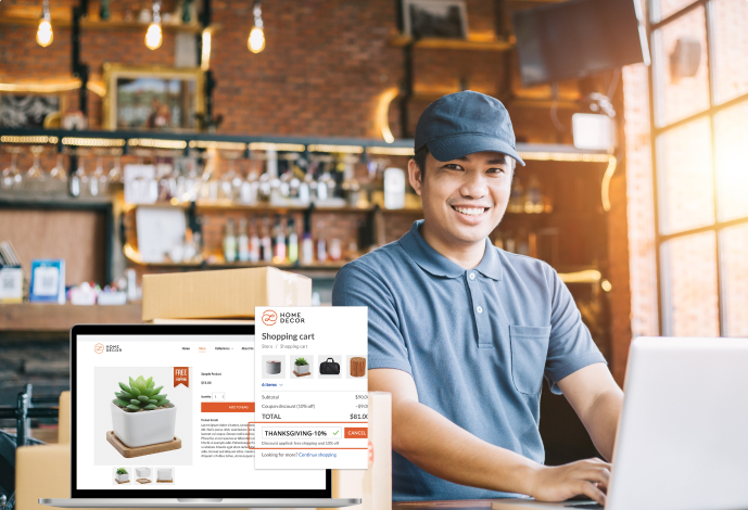 Small business cafe owner working on his eCommerce website on a laptop