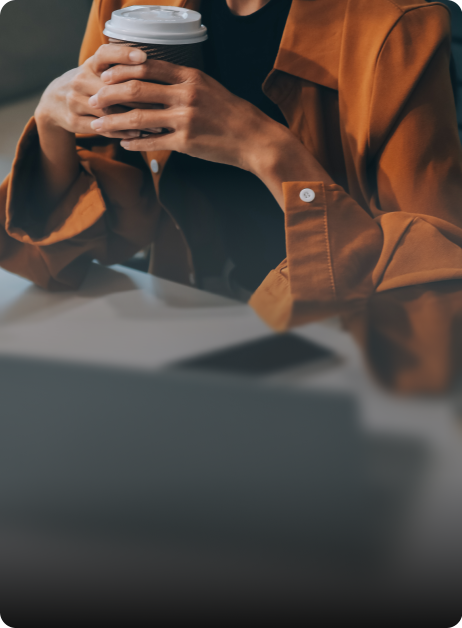 person holding coffee cup