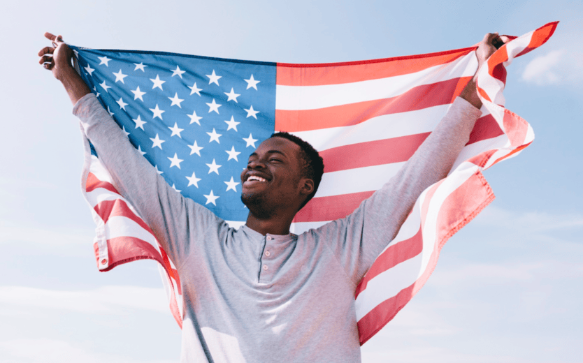 man holding US flag