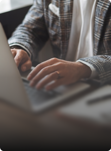 man typing on laptop