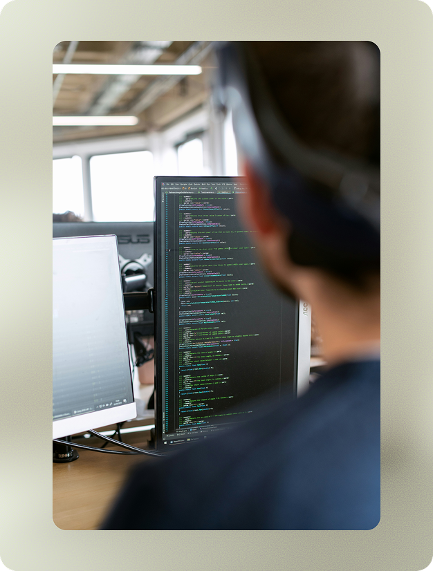 man looking at a desktop