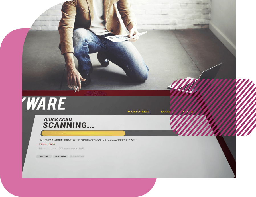 Business man holding a stack of papers while reviewing at a malware scan