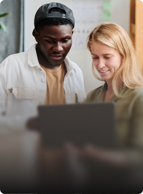 man and woman looking at tablet