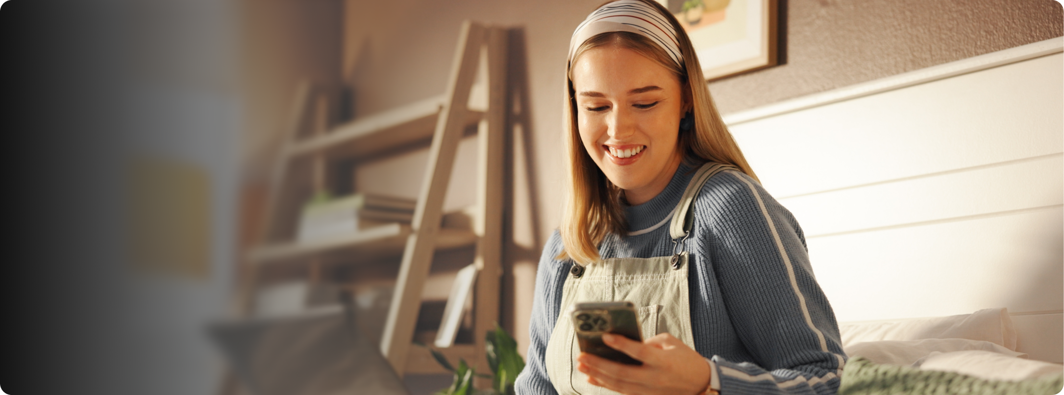 Smiling woman with headset in front of monitor
