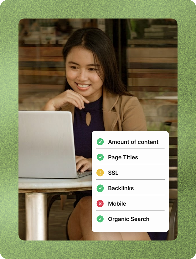 woman smiling at laptop