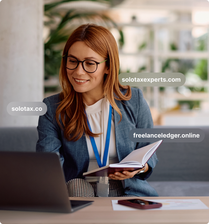 woman looking at laptop smiling